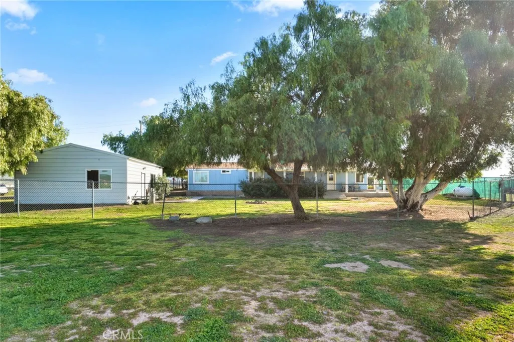 The home and gargage/worshiop is fully fenced with access to the property through a large gate