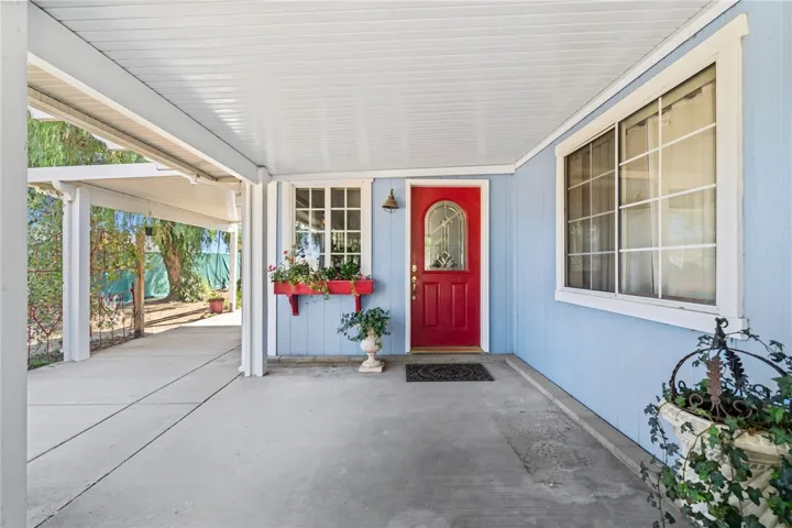 Front door entrance and side patio off living room
