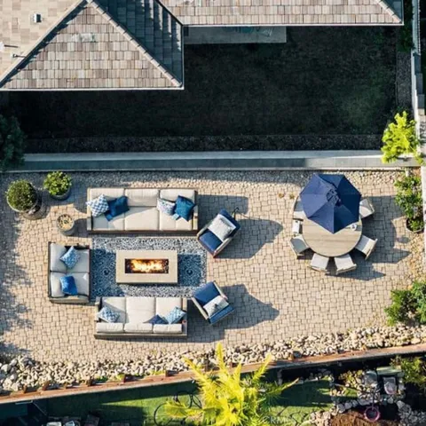 Virtual staging of an aerial photo of back terrace and yard. See prior pic for what it currently looks like.