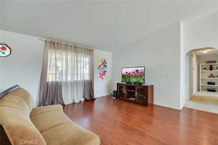 Family room leads to hall way to all 3 bedrooms.