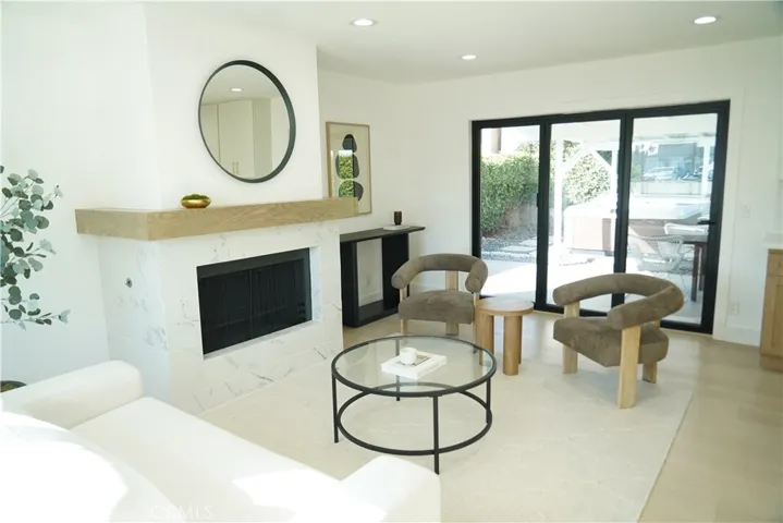 Formal living area with view toward accordion door and backyard