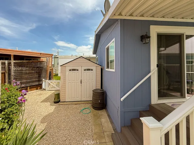 Back yard area with storage shed for your beach toys