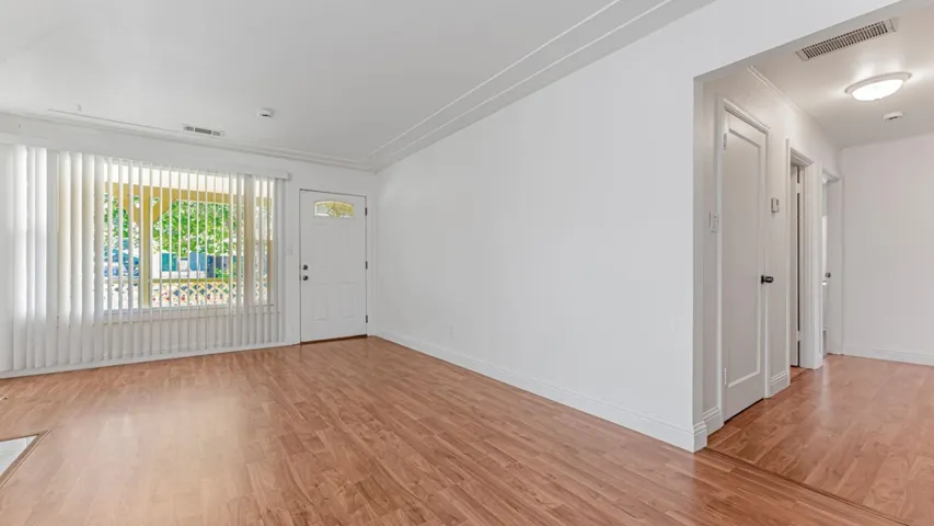 Entrance foyer featuring light wood-style floors