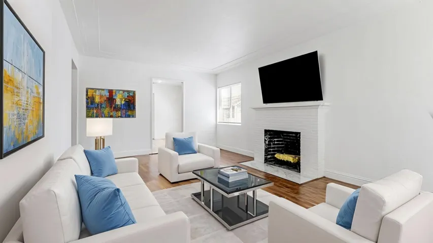 Living room featuring wood finished floors and a fireplace