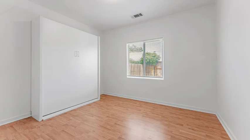 Bedroom with light wood-style floors