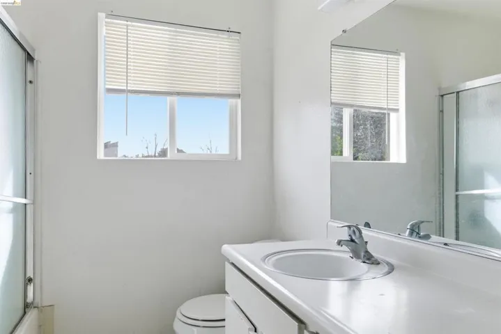 Full bath featuring vanity and a shower with​​‌​​​​‌​​‌‌​​‌​​​‌‌​​​‌​​‌‌​​‌‌​​‌‌​​​​ door