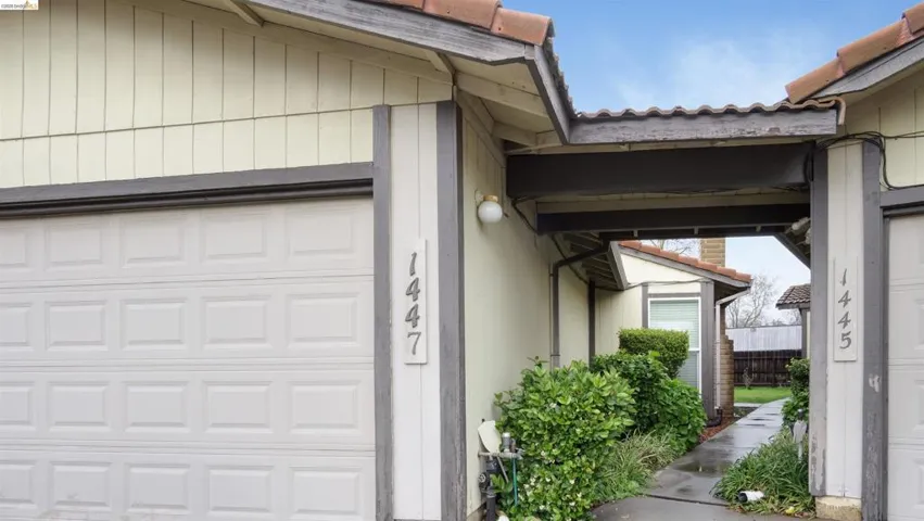 View of side of property with a tiled roof