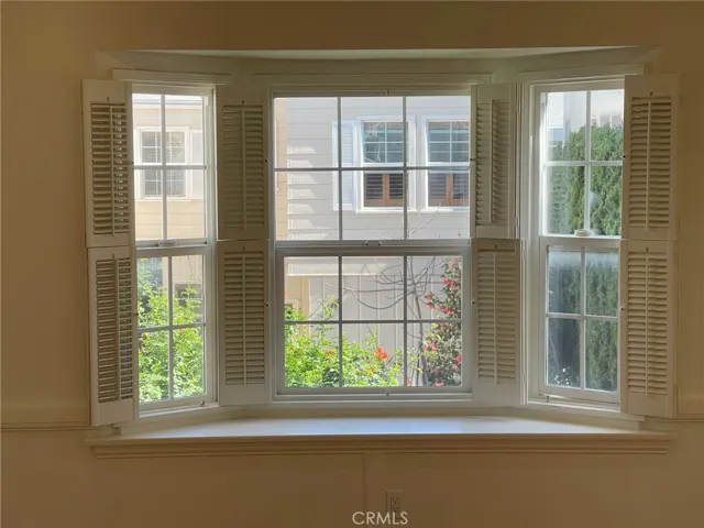 Large open plantation style windows overlooking the beautiful courtyard