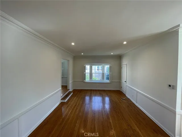 The large spacious living room with a walking closet on the side!