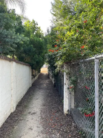 Shaded pathway weaving between houses