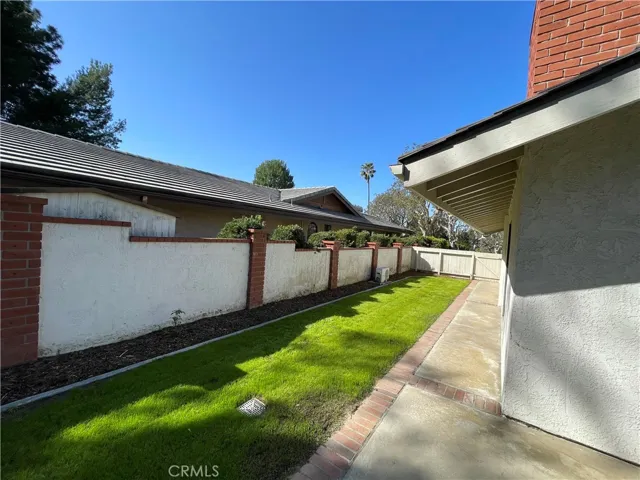 Side yard view of the wraparound grass