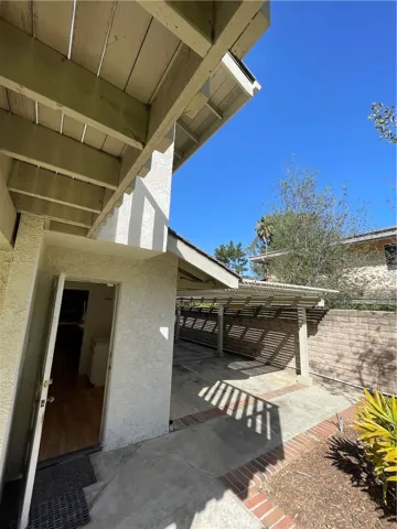 Laundry room door exits to the shaded side yard