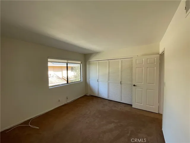 Second upstairs bedroom with carpet and closet