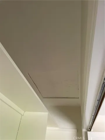 Attic access in the second upstairs bedroom