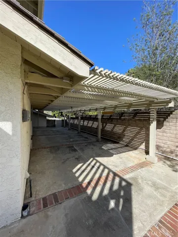 Shaded side yard with concrete