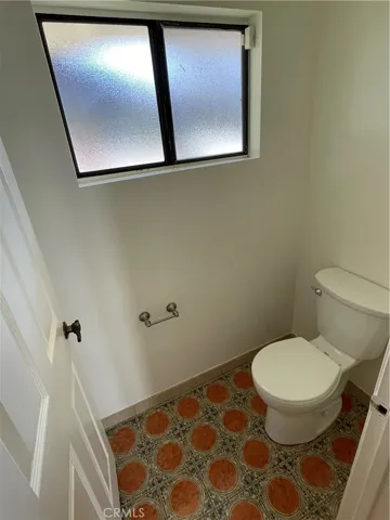 Toilet with door for privacy