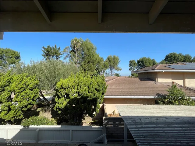 View of the greenery and mountains in the distance from second window