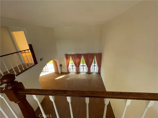 Top-down view of the living room from atop the stairs