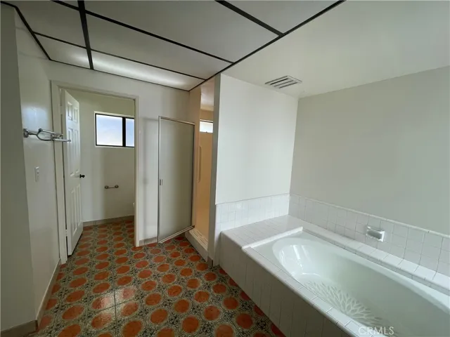 Separate shower and tub, along with a private toilet