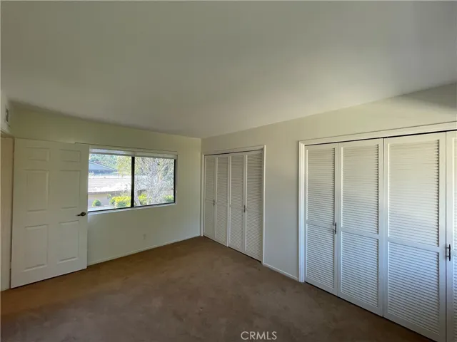 Third upstairs bedroom with two closets