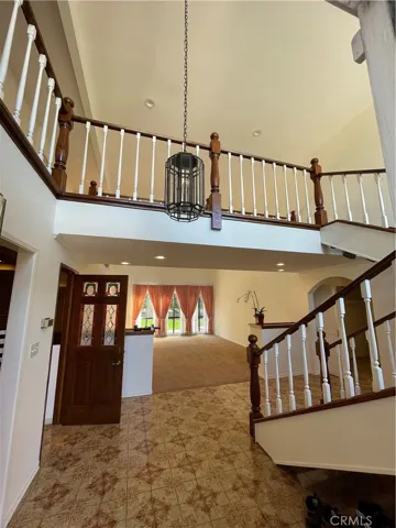 Catwalk staircase and the view upon entering the home