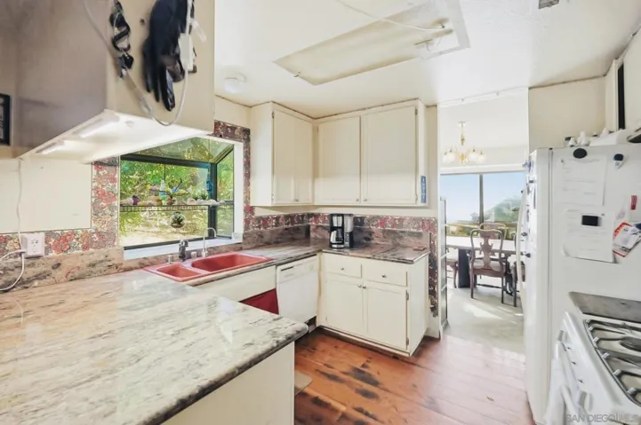 Plenty of counter space and kitchen with garden box window