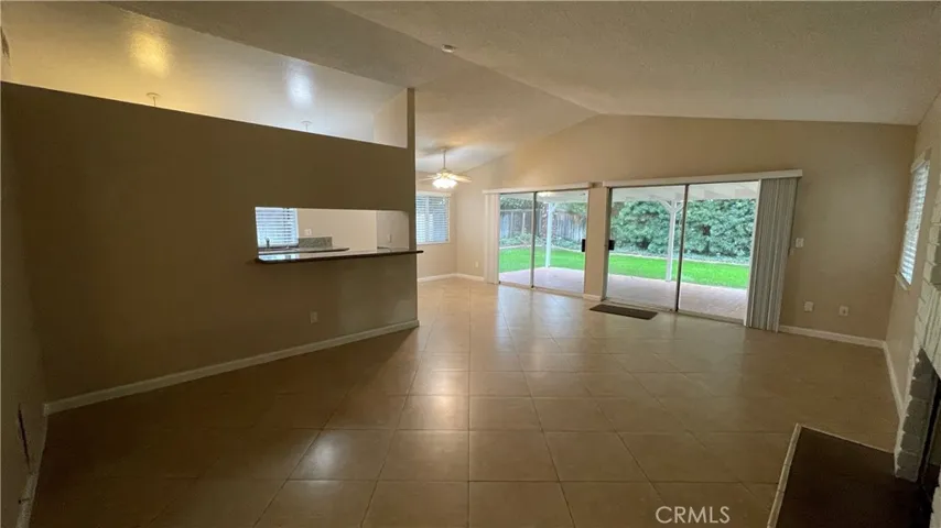 Living room to dining area and patio view
