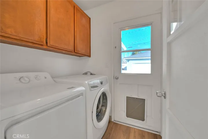 Inside laundry with additional overhead storage