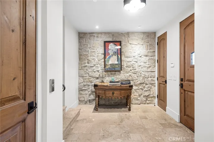 An elevator services the home, providing convenient access between levels.