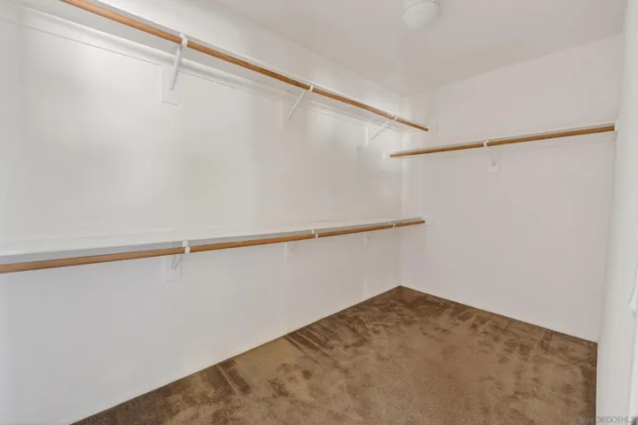 Walk-in closet in primary bedroom