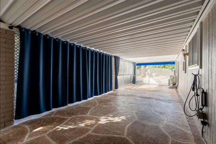 Extended carport with custom overlay