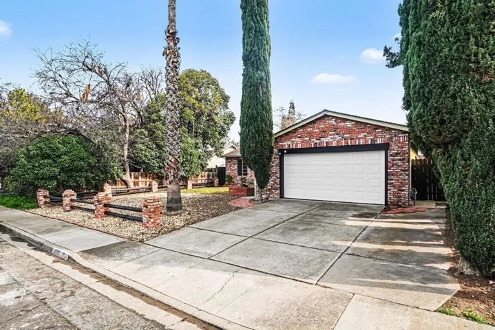 Garage featuring driveway
