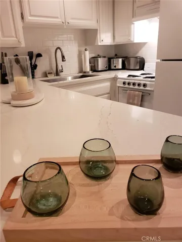 Small stove and full size refrigerator