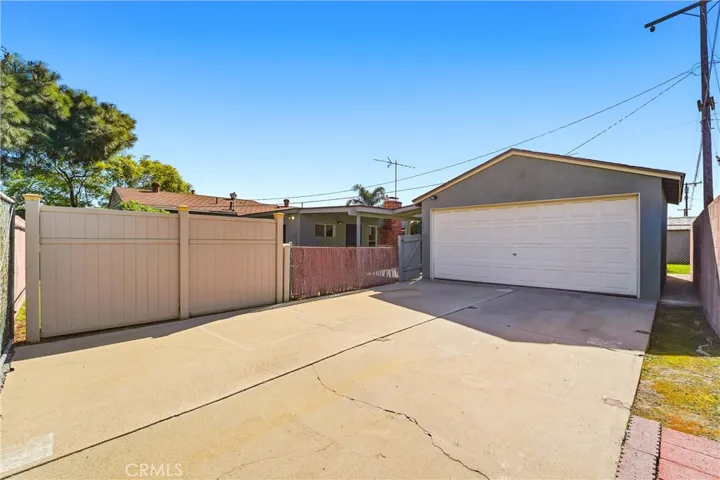 Gated driveway with access to the 2 car detached garage and backyard!