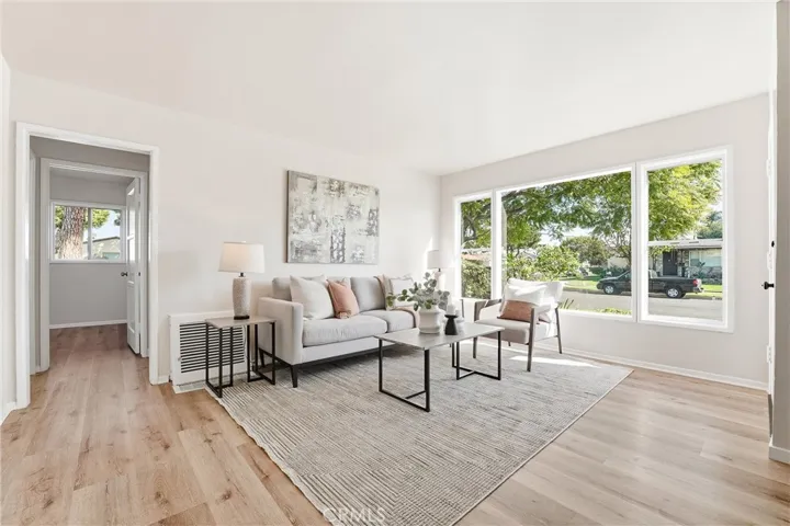 Living room is spacious and boasts of fresh new paint and flooring!