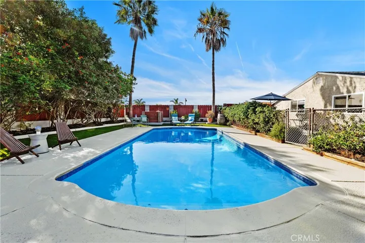 Large in-ground pool has been refreshed with newer tile and plaster.