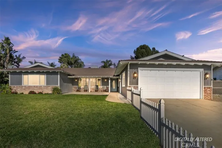 Beautiful landscaped fenced front yard