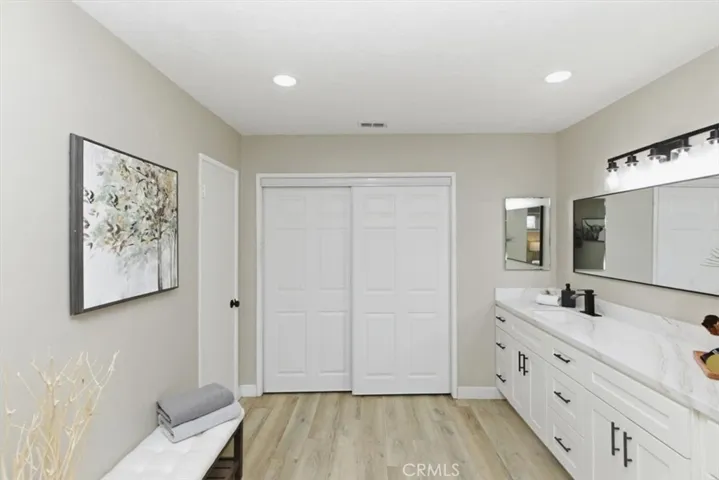 Oversized secondary  bathroom area with closet