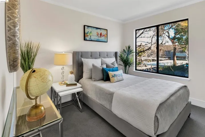 Bedroom with crown molding and carpet flooring