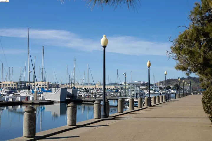 Dock featuring a water view and view of marina