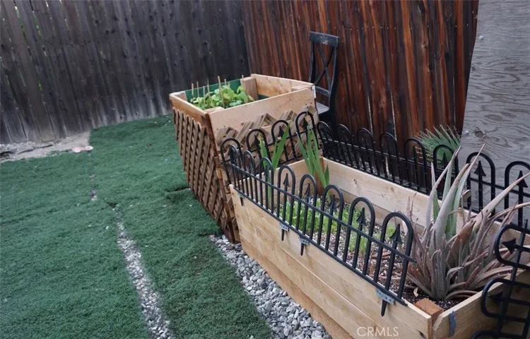 Original back yard planter box pictures. Turf on gravel yard coverage.