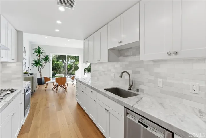 Open living space flows effortlessly toward the kitchen and entry areas, creating an ideal layout for everyday living.