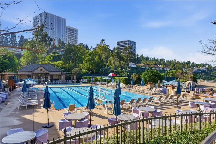 Resort-style pool amenities at Big Canyon Country Club in Newport Beach featuring private cabanas, lounge seating, and a relaxing setting ideal for swimming, socializing, and enjoying Southern California’s coastal lifestyle.
