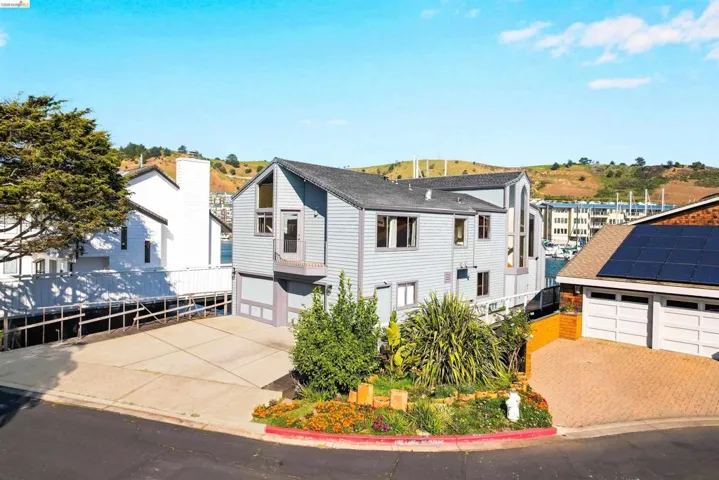 View of front of house with driveway and an attached garage