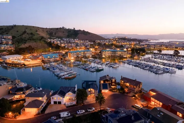 Water view featuring numerous boat docks and a mountain backdrop
