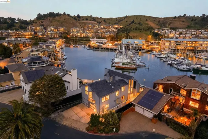 Dock with a water view and view of marina