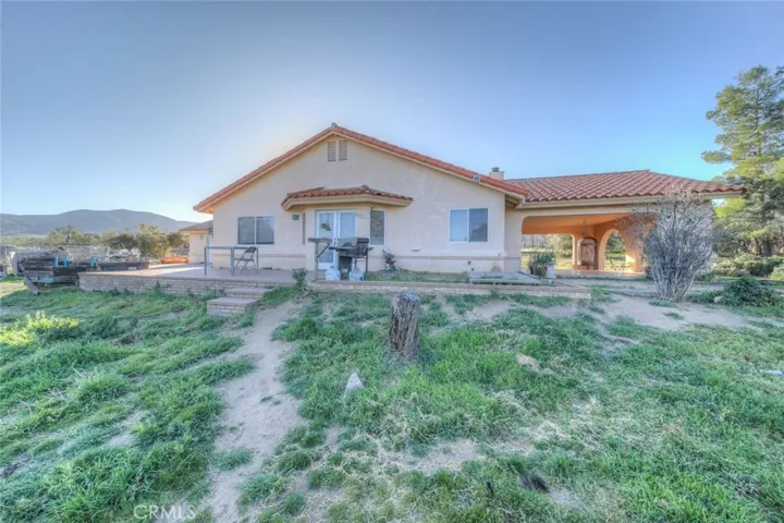 East side of home, with concrete pads