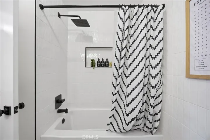 Hallway bathroom with tub, shower, Toto toilets and vanity