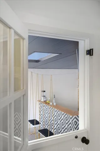 Dutch door off kitchen to backyard, bar, pizza oven