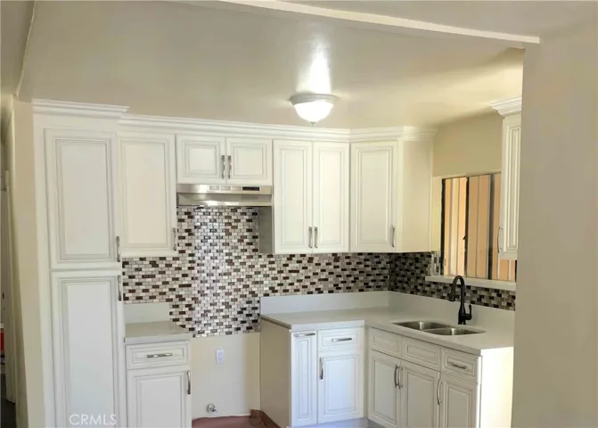 View of 1 bedroom-1 bath back unit. Remodeled kitchen.